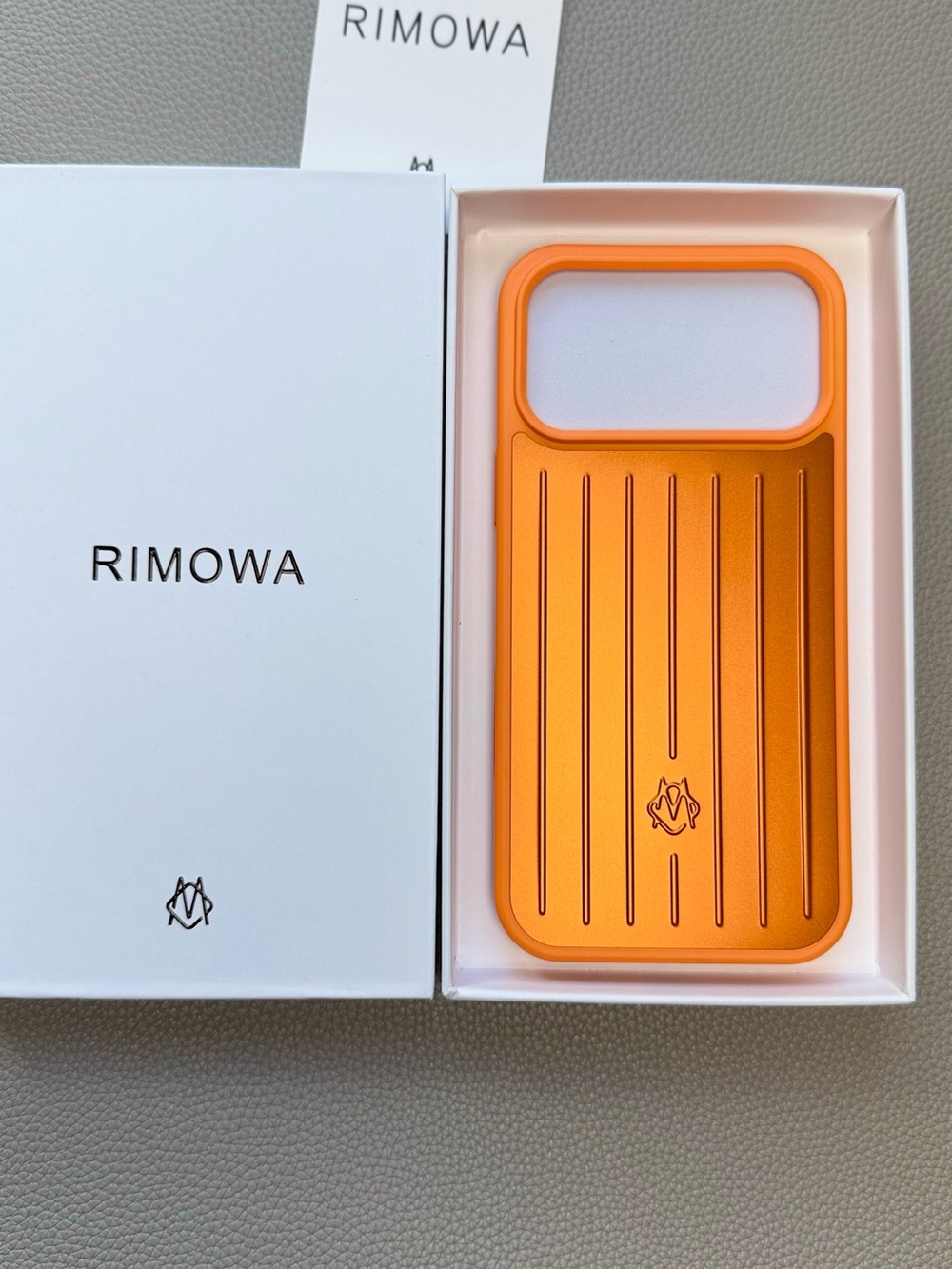 RIMOWA Orange Aluminum Ribbed Phone Case